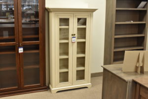 White custom bookcase with glass doors