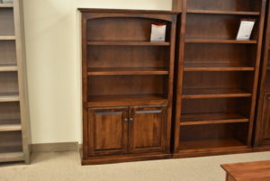 Custom wood bookcase with shelves and doors