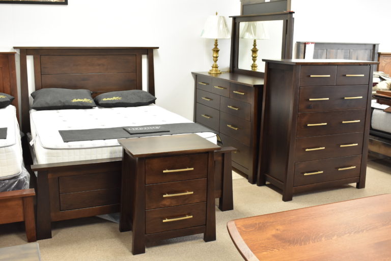 American-made bed with a dresser, chest, nightstand, and mirror